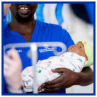 KCON student with infant manikin